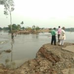 Flooding in India men and road