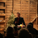 Henderson Luke speaking in barn