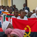 ICOMB 2024 children with flags