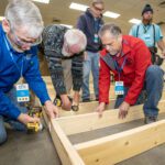 MDS men building wall