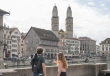 U.S. Mennonite Brethren reflect on anniversary commemoration in Zurich Two students stand overlooking a river in Zurich.