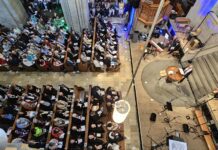 Thousands gather in Zurich to celebrate 500 years of Anabaptism A crowd of people attend a worship service.