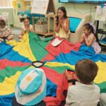 NLC volunteer with children praying
