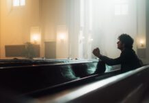 Soledad Sitting in pew alone praying