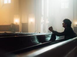 Soledad Sitting in pew alone praying