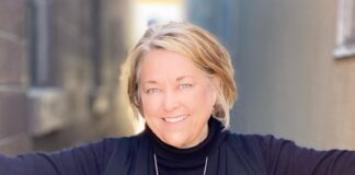 5 minutes with Diane Andrews Woman in black sweater and blouse smiling.