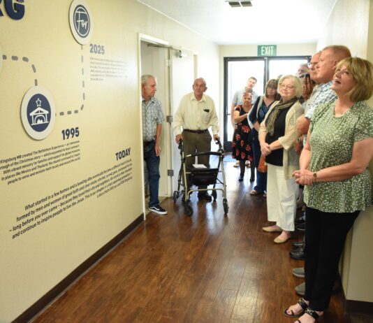 Finding new life Church members look at walls of church.